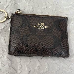 Coach card holder used has some wear on seam